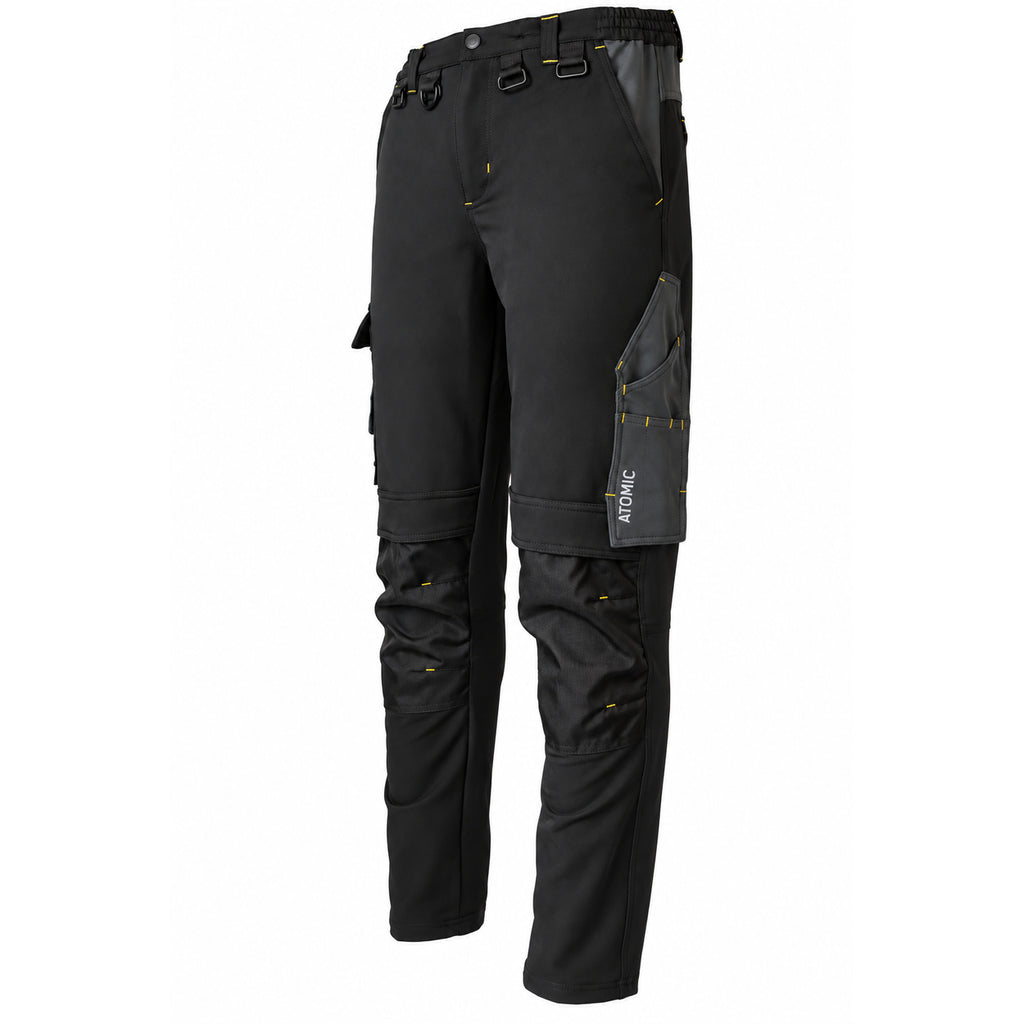 Black technical work pants with dark gray paneling and small yellow stitching accents, shown on a plain white background.